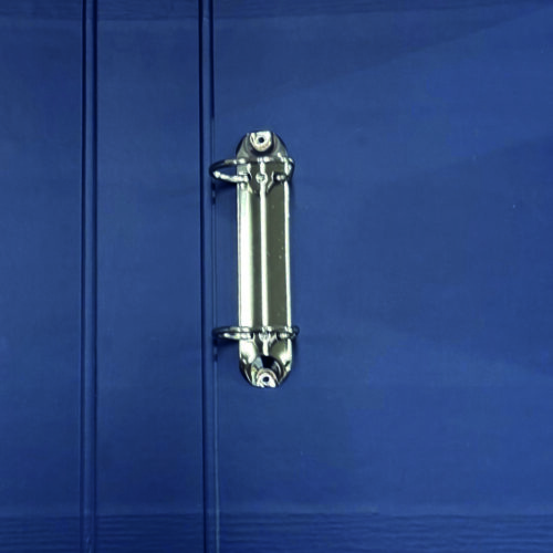 A close-up view of a blue binder featuring a metallic ring closure, showcasing the texture and detail of the binder's surface.